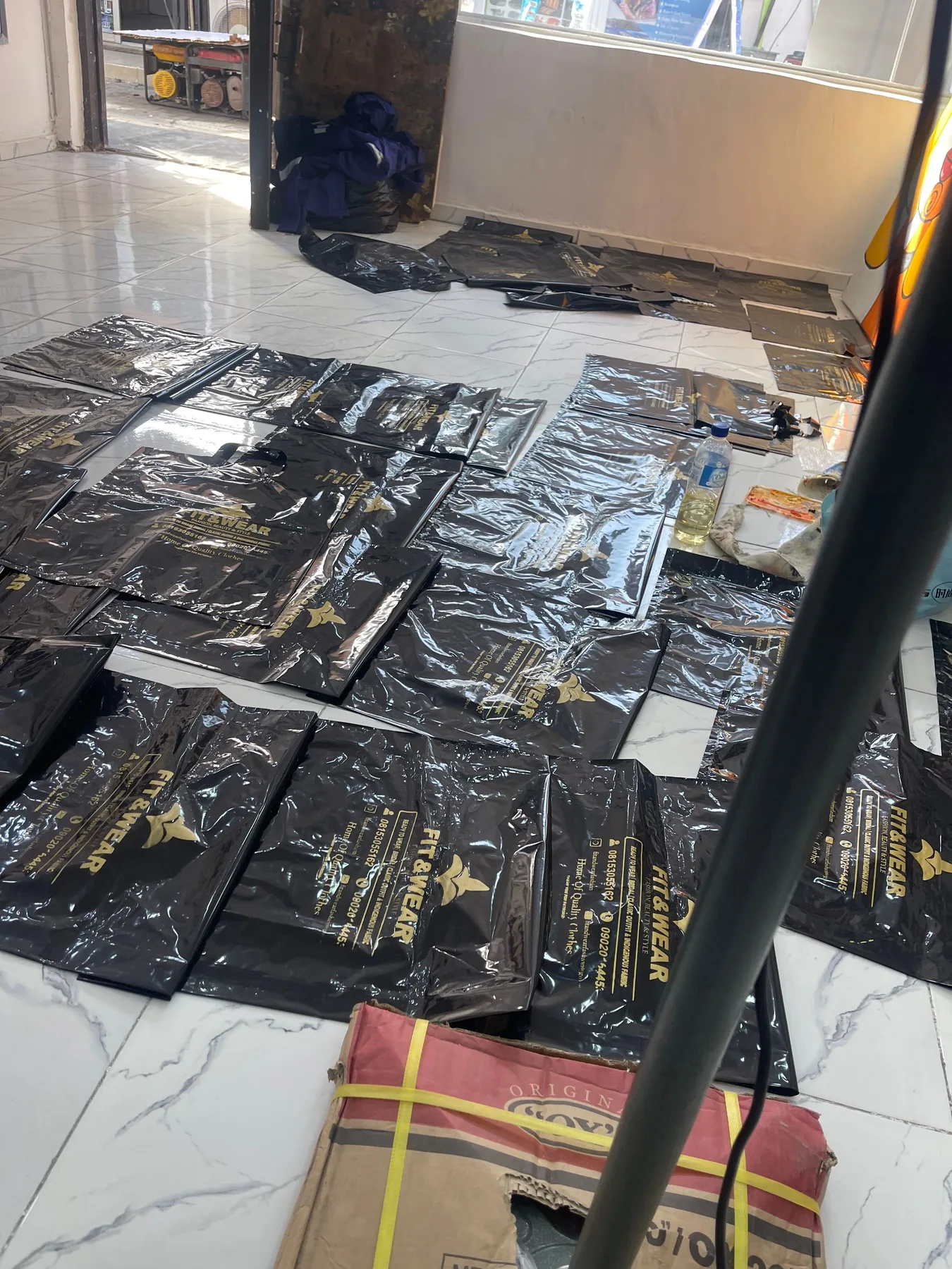 Batch of printed black garments in the studio